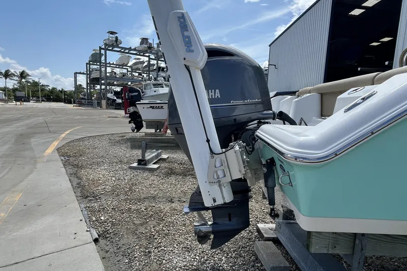 Slide: The Image of 2016 Tidewater 210 LXF boat with Yamaha engine at a marina storage facility. - 6