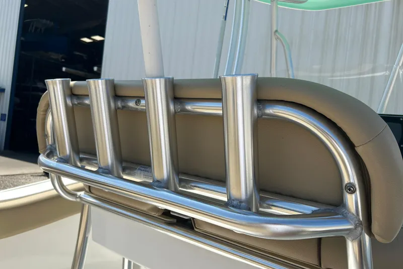 Slide: The Image of Rod holders on a 2016 Tidewater 210 LXF boat, showcasing sleek metal design. - 7