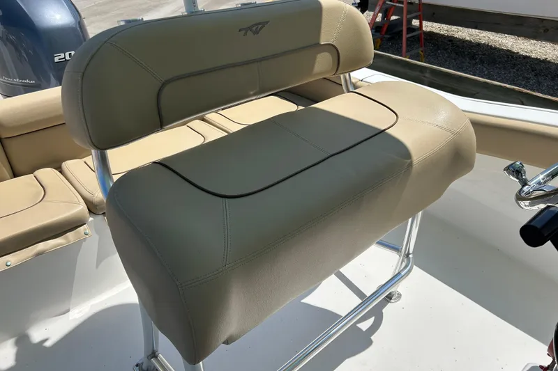 Slide: The Image of 2016 Tidewater 210 LXF boat with beige seating and stainless steel frame. - 8