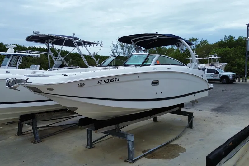The Image of 2022 Four Winns HD8 OB boat on display at a marina. - 0