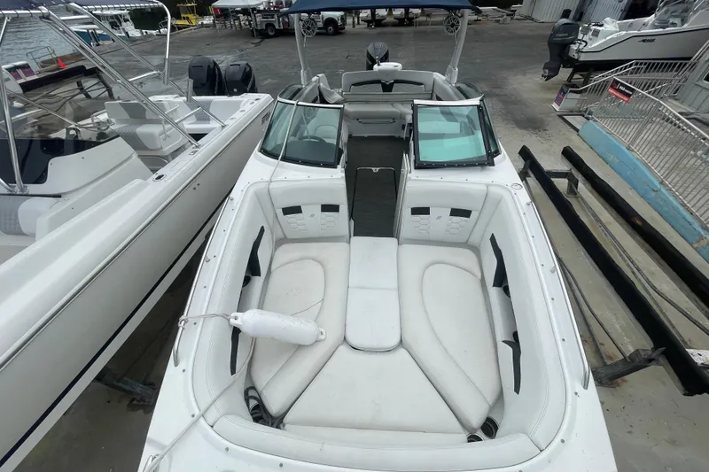 Slide: The Image of 2022 Four Winns HD8 OB boat with spacious white seating and sleek design. - 24