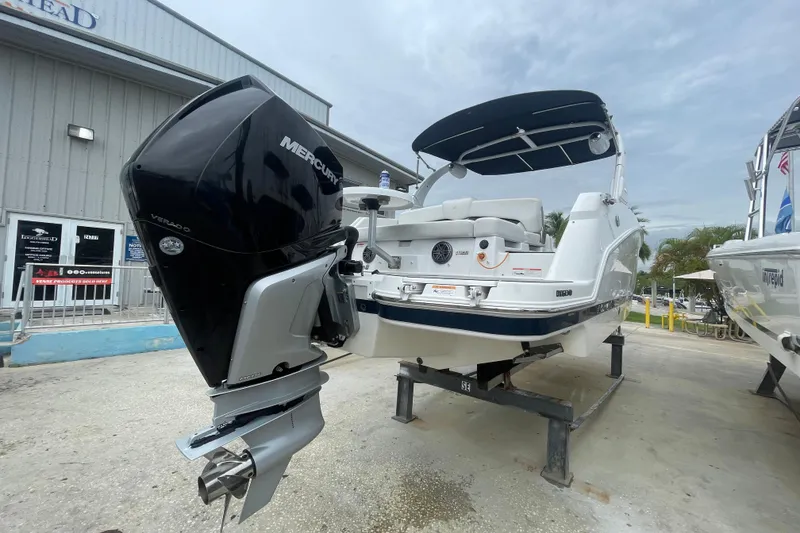 Slide: The Image of 2022 Four Winns HD8 OB boat with Mercury Verado outboard engine, displayed outdoors. - 40