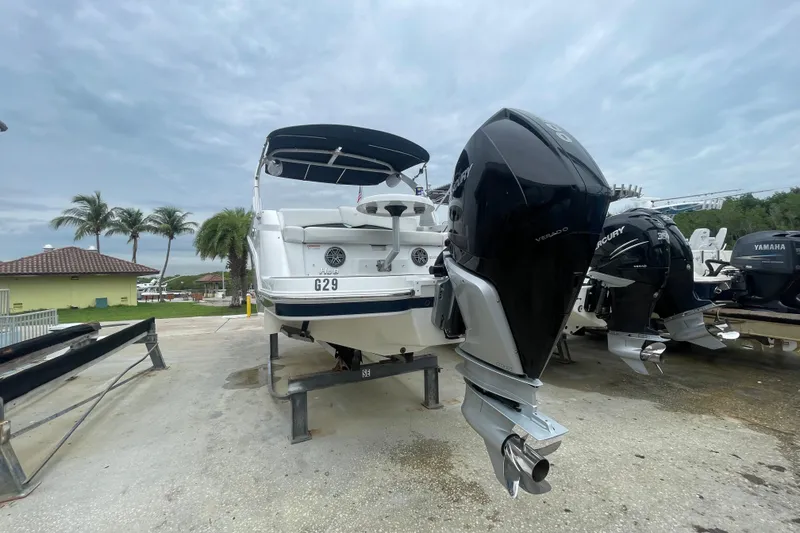 Slide: The Image of 2022 Four Winns HD8 OB boat with Mercury outboard engine on a trailer. - 42