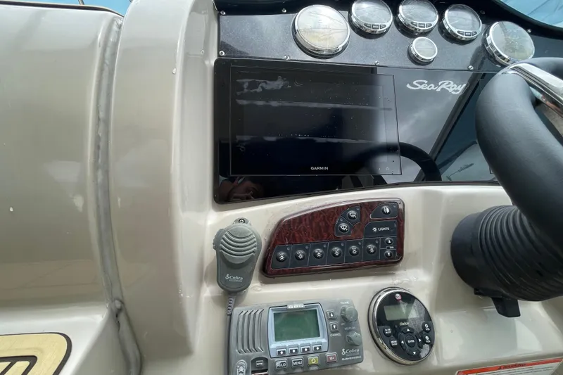 Slide: The Image of Dashboard of a 2006 Sea Ray 290 Sundancer with Garmin navigation system. - 32