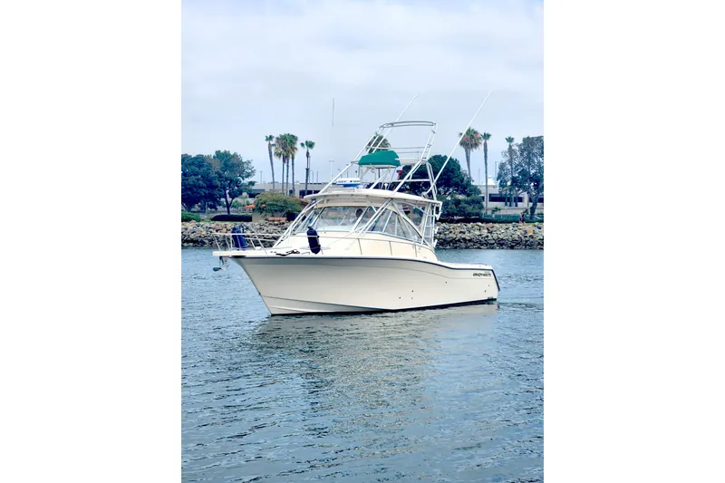 The Image of 2009 Grady-White Express 330 boat on calm water, with palm trees in the background. - 0