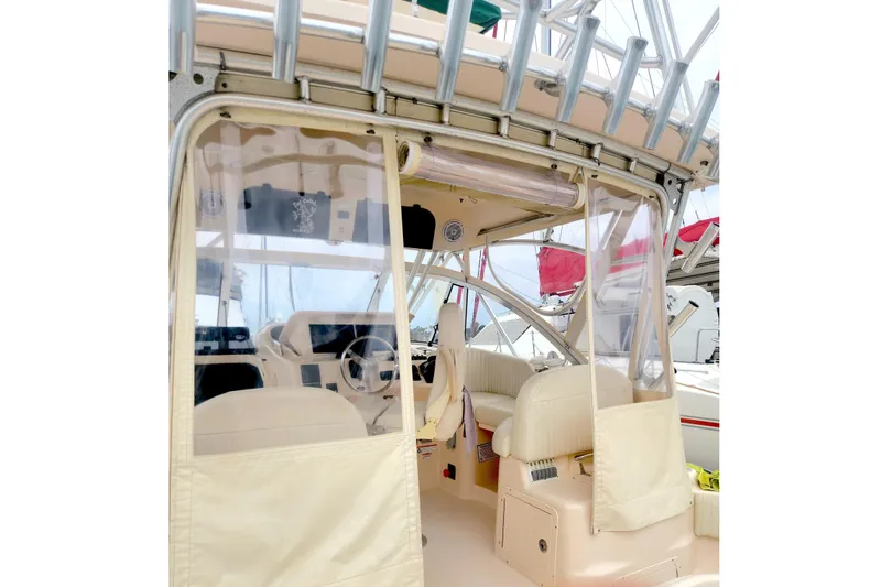 Slide: The Image of 2009 Grady-White Express 330 boat interior with helm and seating area. - 10