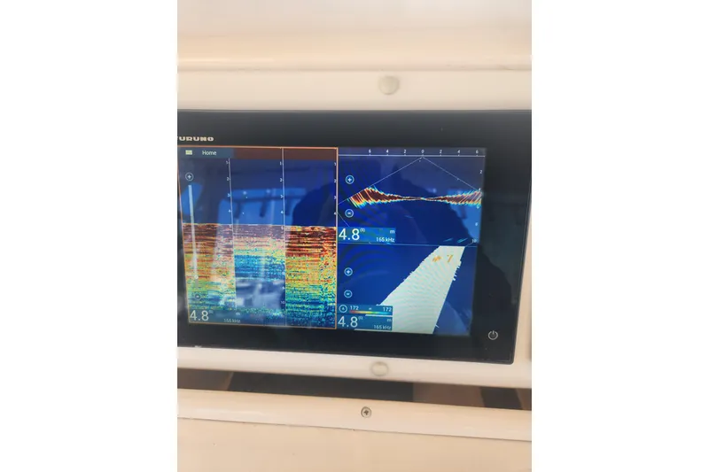 Slide: The Image of Fishfinder display on a 2009 Grady-White Express 330 boat, showing sonar readings. - 22