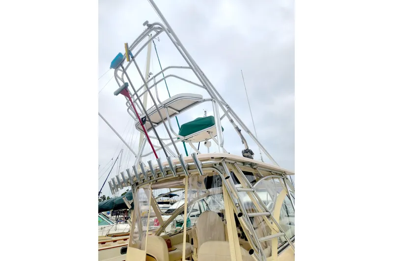 Slide: The Image of 2009 Grady-White Express 330 boat with tower and rod holders. - 4