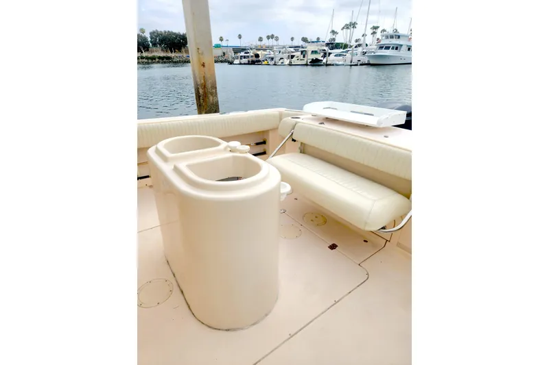 Slide: The Image of 2009 Grady-White Express 330 boat interior with seating and water view. - 7