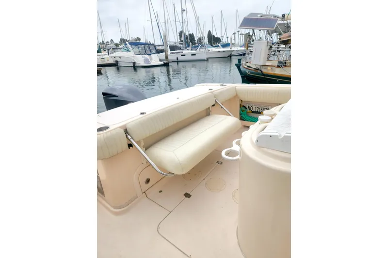 Slide: The Image of 2009 Grady-White Express 330 boat interior with seating, docked at marina. - 8
