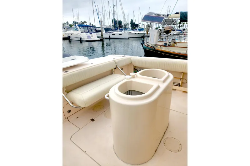 Slide: The Image of 2009 Grady-White Express 330 boat interior with seating and storage, docked at marina. - 9
