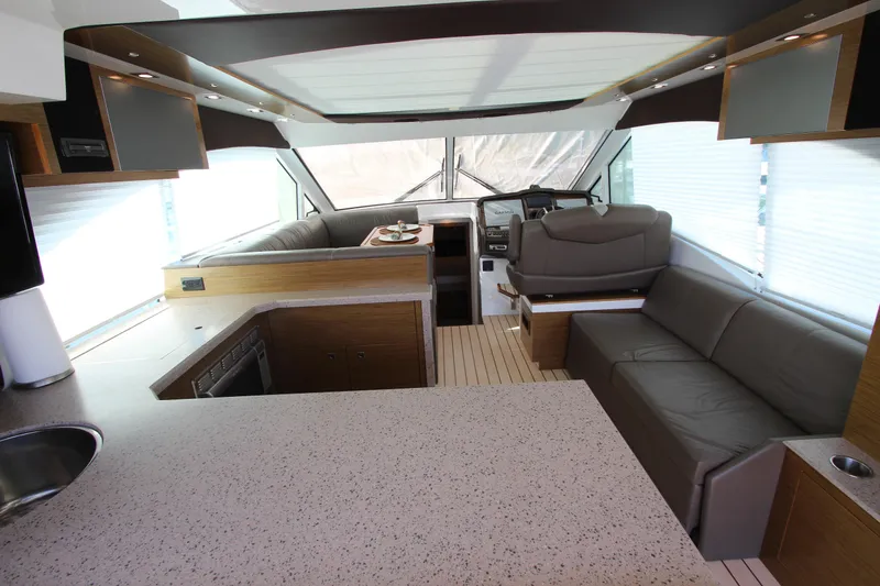 Slide: The Image of Luxurious interior of 2014 Cruisers Yachts 45 Cantius with modern seating and helm. - 10