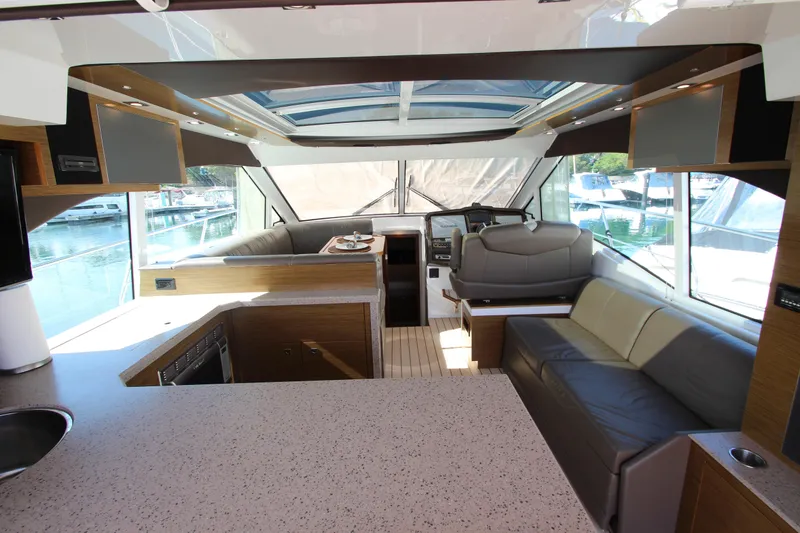 Slide: The Image of Luxurious interior of 2014 Cruisers Yachts 45 Cantius with modern seating and panoramic windows. - 12