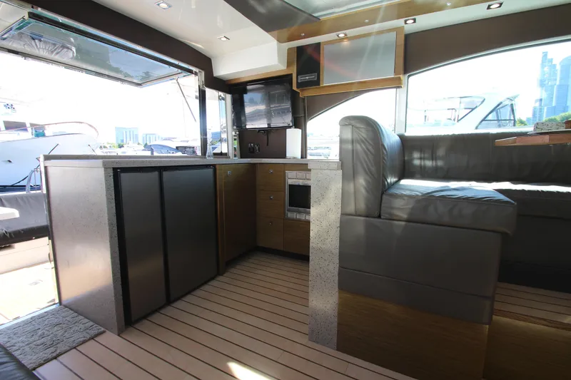 Slide: The Image of Interior of 2014 Cruisers Yachts 45 Cantius with modern kitchen and seating area. - 14