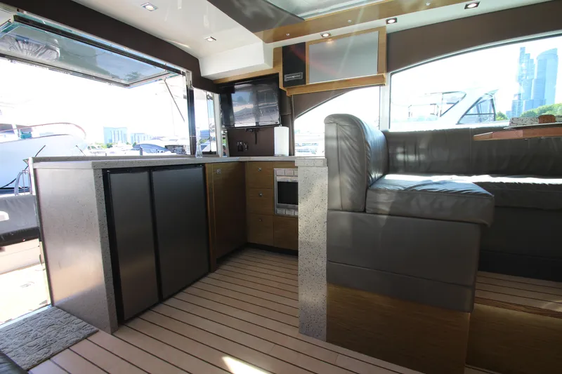 Slide: The Image of Luxurious interior of 2014 Cruisers Yachts 45 Cantius with modern kitchen and seating area. - 15
