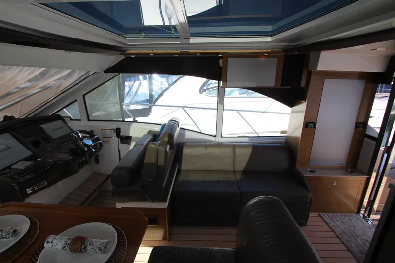 Slide: The Image of Luxurious interior of 2014 Cruisers Yachts 45 Cantius with helm and seating area. - 18