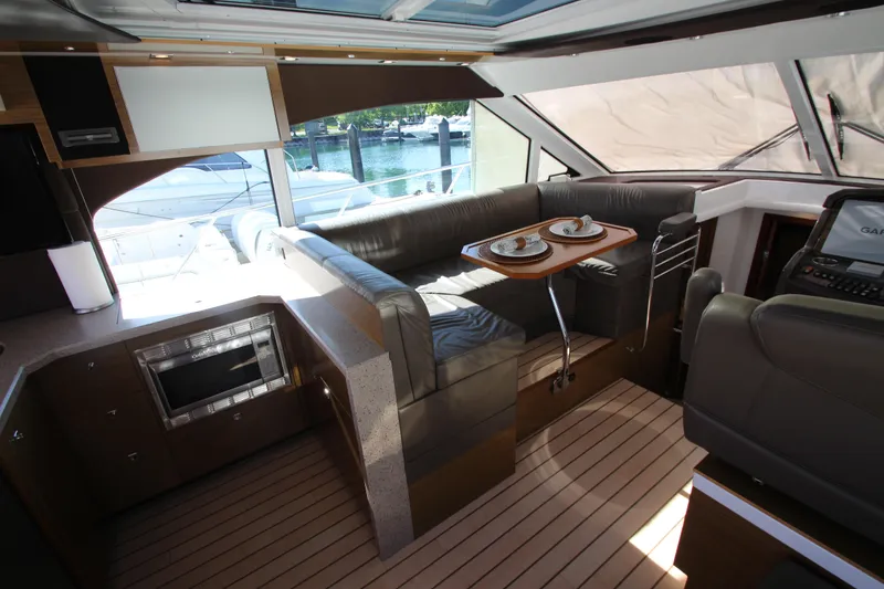 Slide: The Image of Interior of 2014 Cruisers Yachts 45 Cantius with modern seating and dining area. - 22