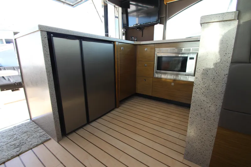 Slide: The Image of Modern kitchen area in 2014 Cruisers Yachts 45 Cantius with stainless appliances. - 26