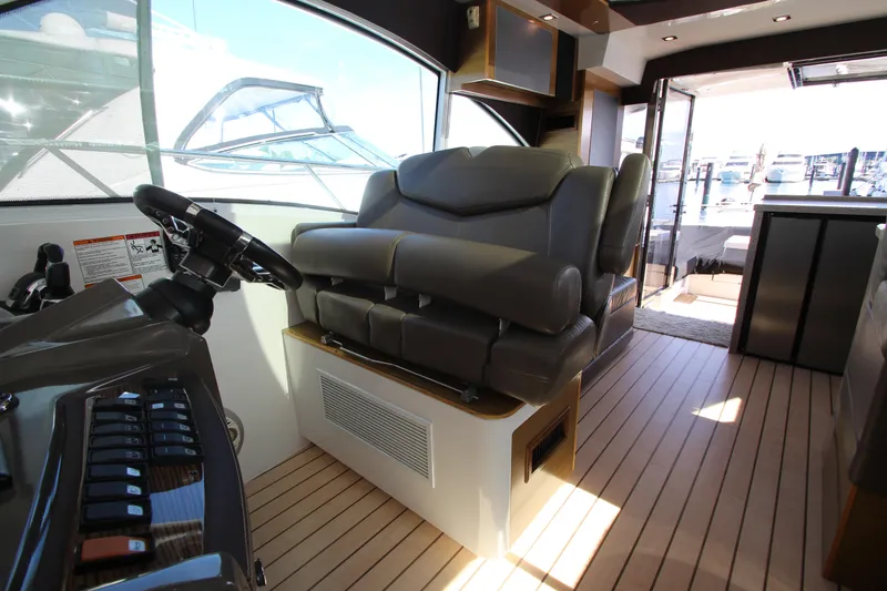 Slide: The Image of Interior of 2014 Cruisers Yachts 45 Cantius with helm and luxurious seating. - 29