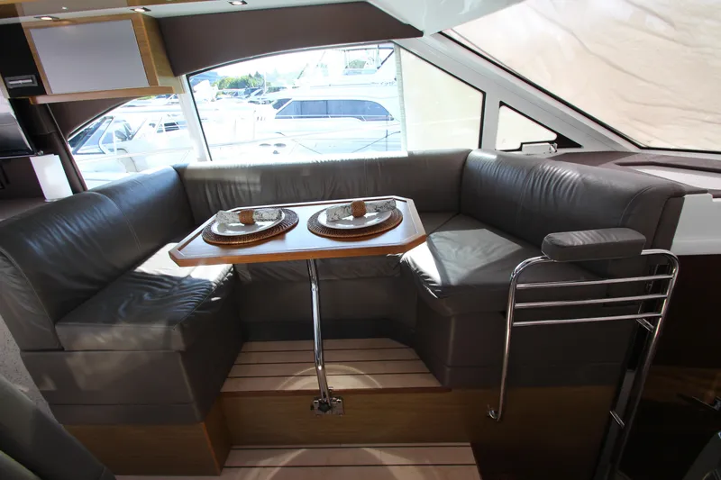 Slide: The Image of Luxurious interior of 2014 Cruisers Yachts 45 Cantius with elegant seating and dining area. - 31