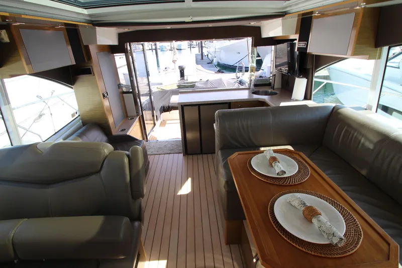 Slide: The Image of Luxurious interior of 2014 Cruisers Yachts 45 Cantius with elegant seating and dining area. - 32