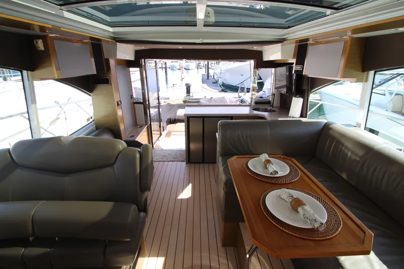 Slide: The Image of Luxurious interior of 2014 Cruisers Yachts 45 Cantius with elegant seating and dining area. - 33