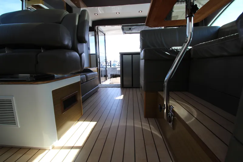 Slide: The Image of Interior of 2014 Cruisers Yachts 45 Cantius with sleek seating and wooden flooring. - 34