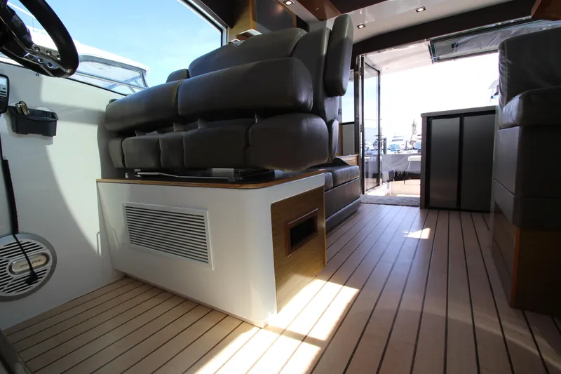Slide: The Image of Interior of 2014 Cruisers Yachts 45 Cantius with modern seating and wooden flooring. - 35