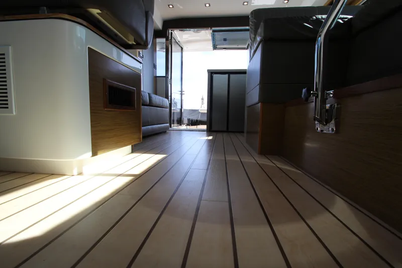 Slide: The Image of Interior view of 2014 Cruisers Yachts 45 Cantius, showcasing sleek wooden flooring. - 36