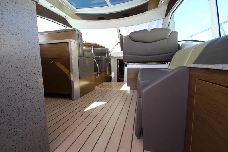 Slide: The Image of Interior of 2014 Cruisers Yachts 45 Cantius with modern seating and wood flooring. - 37