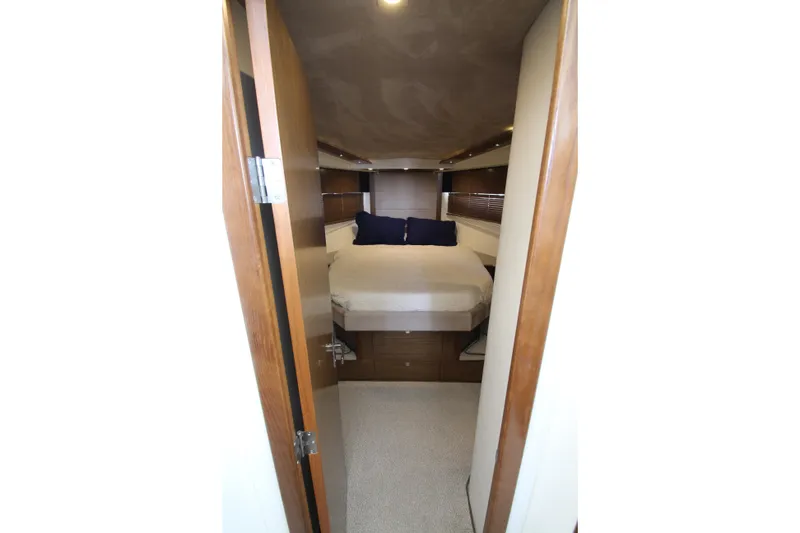 Slide: The Image of Luxurious cabin interior of 2014 Cruisers Yachts 45 Cantius with cozy bed and wooden accents. - 39