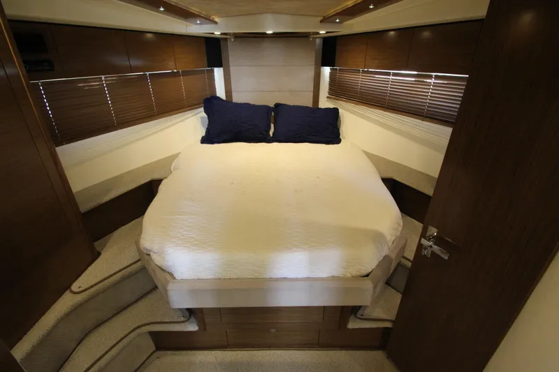 Slide: The Image of Luxurious bedroom interior of 2014 Cruisers Yachts 45 Cantius with cozy bed and wooden accents. - 40