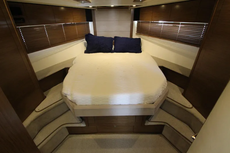 Slide: The Image of Luxurious bedroom interior of 2014 Cruisers Yachts 45 Cantius with cozy bed and wooden accents. - 41