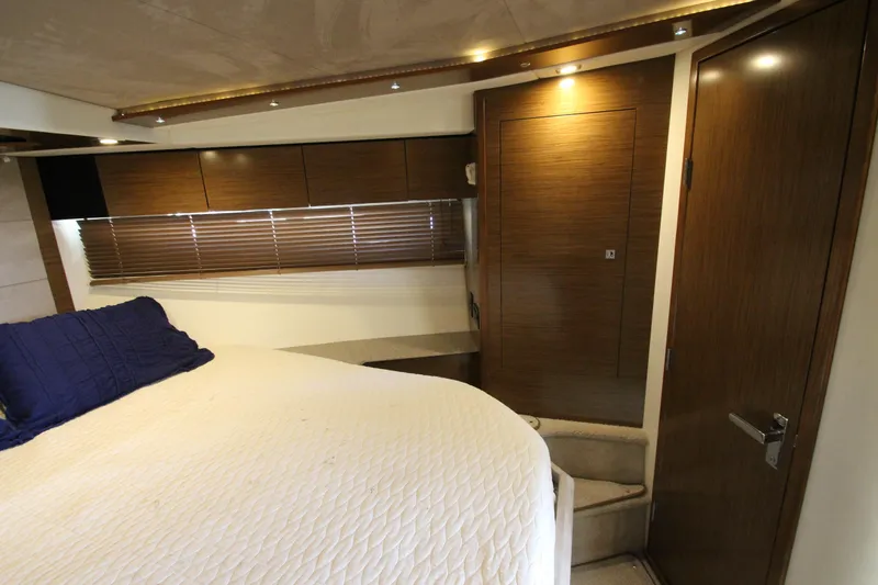 Slide: The Image of Luxurious cabin interior of 2014 Cruisers Yachts 45 Cantius with wood paneling and cozy bedding. - 43