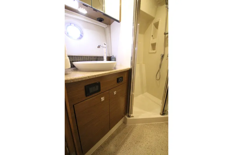 Slide: The Image of Luxurious bathroom in 2014 Cruisers Yachts 45 Cantius with modern sink and shower. - 45