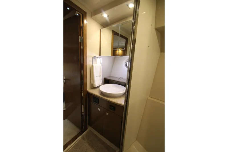 Slide: The Image of Luxurious bathroom in 2014 Cruisers Yachts 45 Cantius with modern fixtures and elegant design. - 48