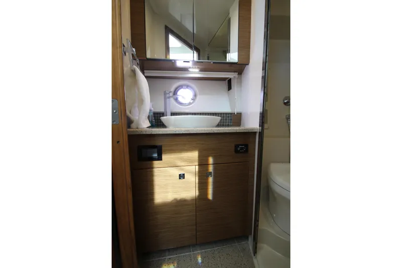 Slide: The Image of Bathroom interior of 2014 Cruisers Yachts 45 Cantius, featuring modern sink and cabinetry. - 53
