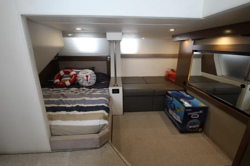 Slide: The Image of Luxurious 2014 Cruisers Yachts 45 Cantius cabin interior with cozy bed and modern decor. - 56