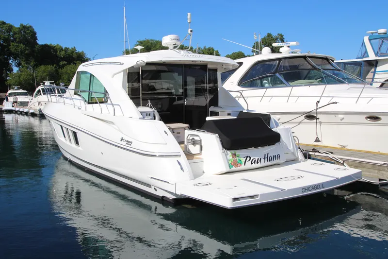 Slide: The Image of 2014 Cruisers Yachts 45 Cantius docked in a marina, sunny day, clear blue sky. - 6