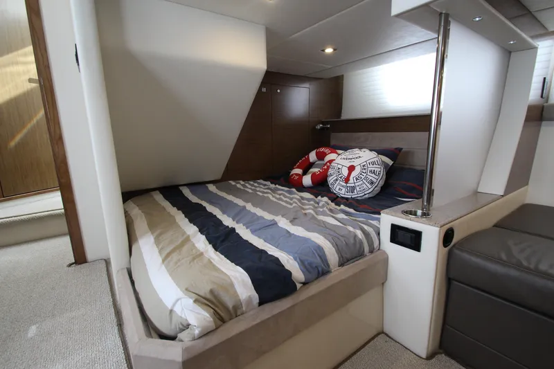 Slide: The Image of Luxurious bedroom interior of 2014 Cruisers Yachts 45 Cantius with striped bedding and nautical decor. - 60