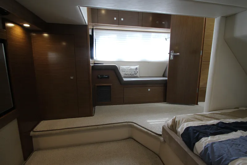 Slide: The Image of Luxurious interior of 2014 Cruisers Yachts 45 Cantius with modern wood finishes. - 62