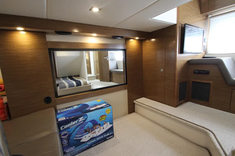 Slide: The Image of Luxurious interior of 2014 Cruisers Yachts 45 Cantius with modern amenities and cozy seating. - 63