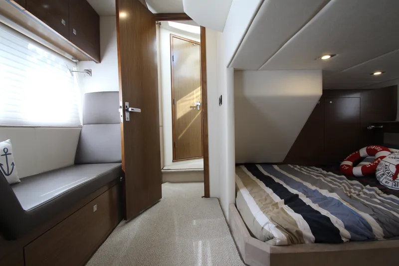 Slide: The Image of Luxurious interior of 2014 Cruisers Yachts 45 Cantius with cozy bed and seating area. - 68