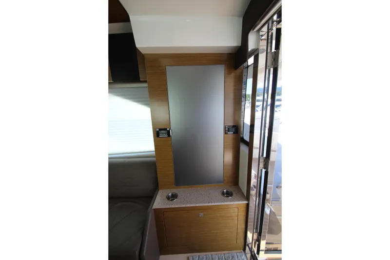 Slide: The Image of Interior of 2014 Cruisers Yachts 45 Cantius with sleek wood paneling and modern design. - 76