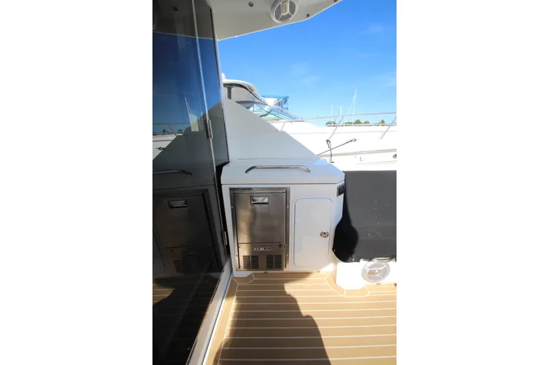 Slide: The Image of 2014 Cruisers Yachts 45 Cantius deck area with sleek design and modern amenities. - 77