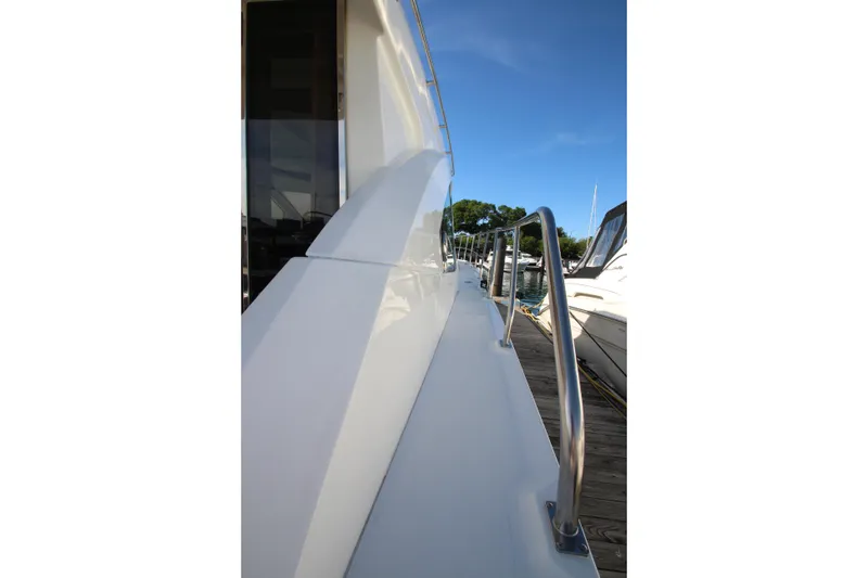 Slide: The Image of Side view of 2014 Cruisers Yachts 45 Cantius docked at marina. - 81