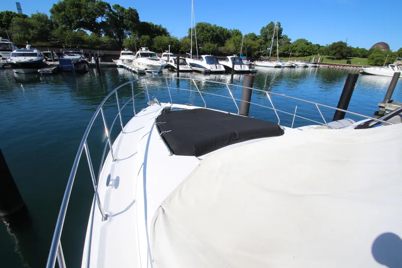 Slide: The Image of 2014 Cruisers Yachts 45 Cantius docked in a serene marina setting. - 86