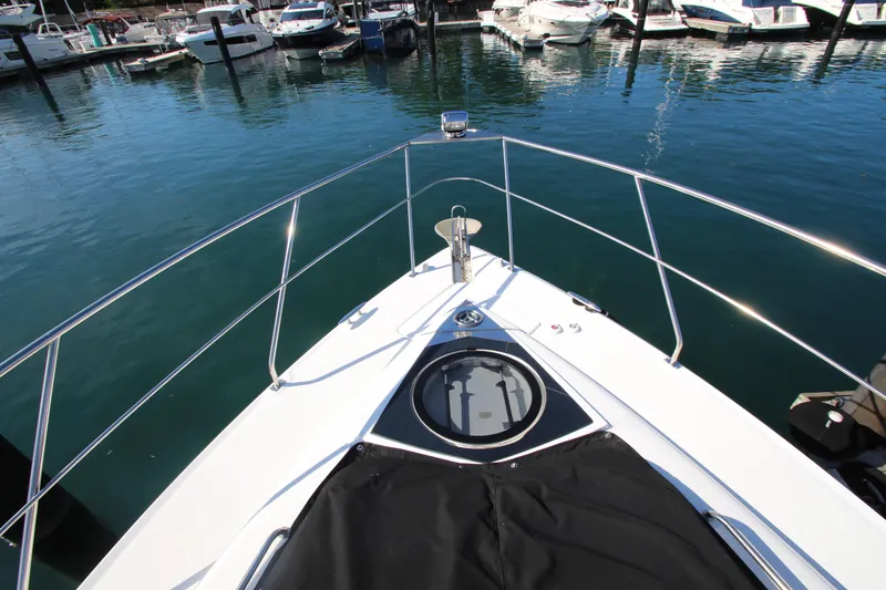 Slide: The Image of Bow view of 2014 Cruisers Yachts 45 Cantius docked in a marina. - 87
