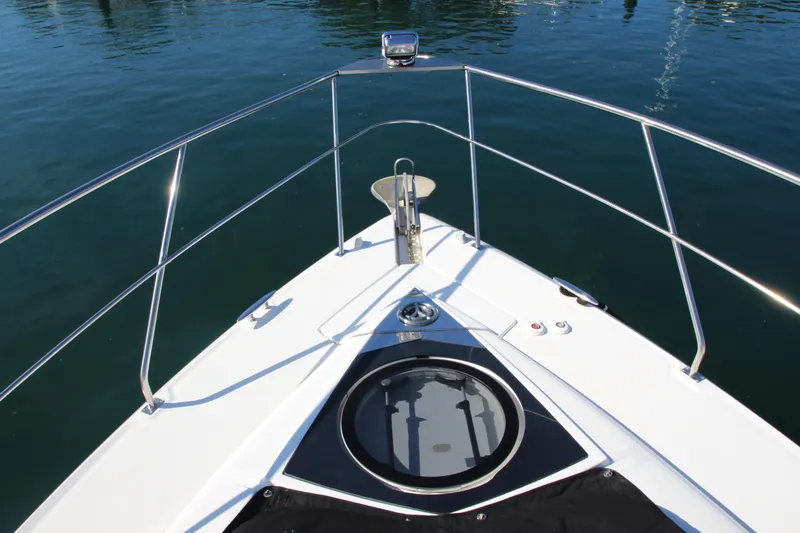 Slide: The Image of Bow view of 2014 Cruisers Yachts 45 Cantius on calm water. - 88