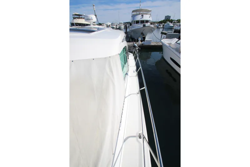 Slide: The Image of 2014 Cruisers Yachts 45 Cantius docked at marina, side view. - 94